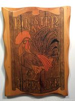 Front view of handcrafted wooden screen print titled 'Rooster Inn' with rooster illustration and 'Food & Drink' text.