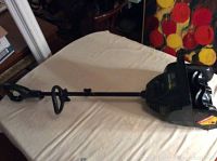 Full view of the Yardworks electric snow shovel showing the handle, trigger grip, and motor housing.