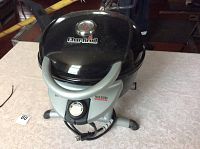 Photo of the full BBQ grill with closed lid showing Char Broil branding and built-in thermometer.