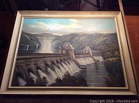 Full view of the framed oil painting depicting a dam with mountains and water body in the background.