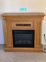 Front view of oak electric fireplace mantel
