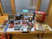 Overview of all tools displayed on a table showing the variety of tools and their packaging.
