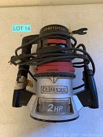 Top-down photo of Craftsman 2 HP router showing front logo and power cord wrapped around tool