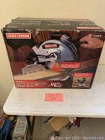 Front view of the unopened box for a Craftsman 10-inch compound miter saw with Laser Trac feature, showing brand and model number 924315