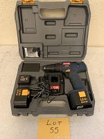 Ryobi drill kit in molded plastic case including drill, charger, battery, and power cord. Battery labeled 12.0V Ryobi. Drill blue and black with orange branding.