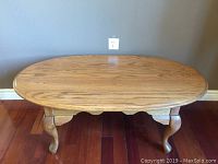 Top view of the solid oak oval coffee table showing wood grain and oval shape.