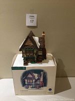 Front view of The Spider Box Locks house displayed on original foam box with sleeve.