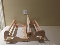 Full view of loom assembled on tabletop showing warp beam, heddle, and cloth beam