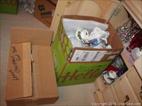 Boxes containing wrapped and loose Christmas dinnerware and glassware items