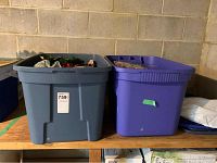 Side-by-side view of two large plastic bins containing Christmas decorations