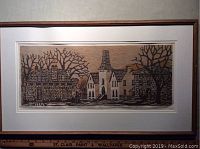 Full view of framed woodcut print showing frame and matting