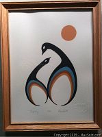 Full view of framed screen print showing stylized bird figures under an orange circle (sun or moon) with signature and numbering at the bottom.