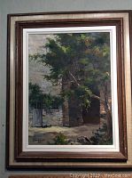 Full view of framed oil painting showing stone archway, small door, tree and adjacent wall.