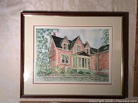 Framed original watercolour painting of a red brick house, triple matted and behind glass.