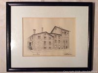 Framed ink drawing of a stone building with the title "Kingston Brewery" below the image, signed by the artist.