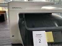 Front view of HP OfficeJet Pro 8720 all-in-one printer showing model label and paper tray