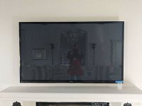 Front view of Samsung 60" TV mounted on wall
