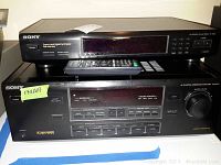 Sony TA-AV571 integrated amplifier stacked below Sony ST-JX661 tuner, showing front panels