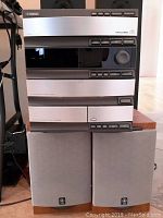 Full view of the stacked Yamaha GX500 stereo system including tuner, amplifier, cassette deck, and two speakers positioned below.