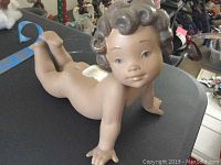 Front angle of the Lladro angel figurine showing the cherub's facial details and wings.
