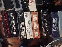 Photo showing VHS tapes including High Crimes, Seabiscuit, Crimson Tide, The Rookie, Wild Wild West, Blade II, and Superfly