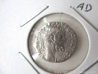 Obverse side of the Roman silver denarius coin showing the profile of Emperor Septimius Severus with worn details.