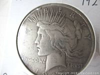 Obverse side of the 1922 Peace Silver Dollar showing Lady Liberty bust with radiate crown and inscriptions.