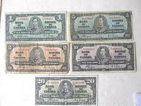 All five 1937 Canadian banknotes in one photo showing 1, 2, 5, 10, and 20 dollar bills with King George VI portrait.
