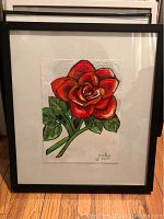 Front view of framed red rose painting with black frame and white mat, signed Jenik 2018