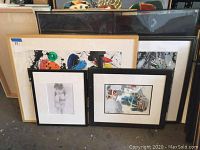 Five framed original artworks by Jenik Cook arranged together showing varied sizes and styles including abstract and figurative pieces