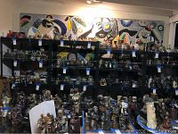 Full mural above shelves of pottery