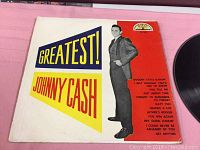 Front cover of 'Greatest! Johnny Cash' vinyl LP showing artist image, title and song list.