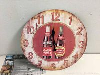 Full front view of the round vintage Double Cola advertising wall clock showing its overall condition and design.