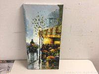 Front view of the original oil painting on canvas showing a rainy street scene, horse and carriage, building with lit window, and plants.