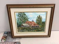 Full view of the framed oil painting showing the farm scene with barn and trees.