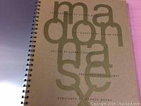 Spiral-bound interior page showing stylized 'madonna' title with publishing credits.