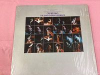 Front cover of vinyl LP showing performance photos of Jimi Hendrix and Otis Redding with shrink wrap intact.