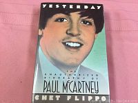 Front cover of the book showing a portrait illustration of Paul McCartney with title and author name.