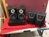 Sony 5 CD player with Braxton bookshelf speakers on a red cloth surface