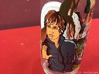 Close-up photo of the glass showing detailed illustration of Luke Skywalker in black outfit with hand raised