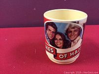 Vintage Dukes of Hazzard mug showing main characters and title logo.