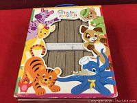 Box of Baby Einstein board books showing 12 books inside with animal illustrations on the box