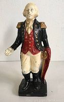 Front view of vintage George Washington figural bank showing full figure and colors.