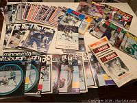 Overhead view of entire lot showing magazines and programs spread across table