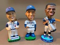 Front view of the three bobbleheads: Billy Koch, Eric Hinske (Toronto Blue Jays), and Michael Clemons (Toronto Argonauts)