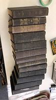 Stacked set of thirteen The Clydesdale Stud Books showing spine titles and overall condition.