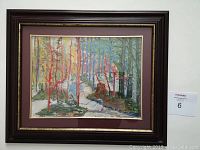 Framed colorful forest lithograph with dark wooden frame and maroon matte.