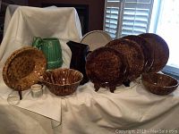 Full lot display of Bennington pottery pieces, Green Gibson pitcher, and Sylvac bowl