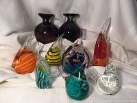 Group view of all eight items on draped fabric