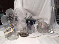 Group photo showing the entirety of the lot including several vases, decorative bowls, and candle holder, all arranged against white draped background.